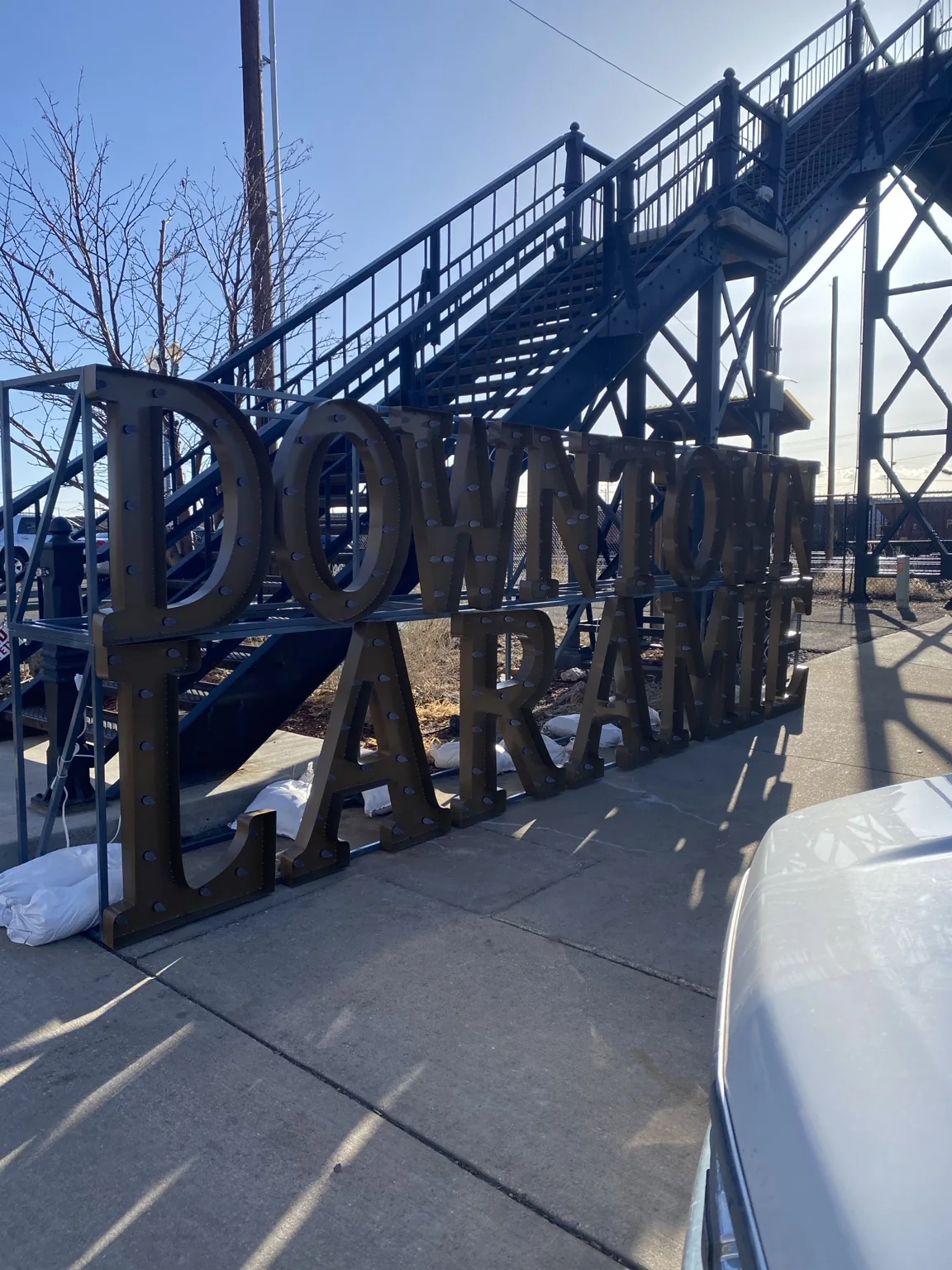 Downtown Laramie marquee-style sign installed by the historic footbridge