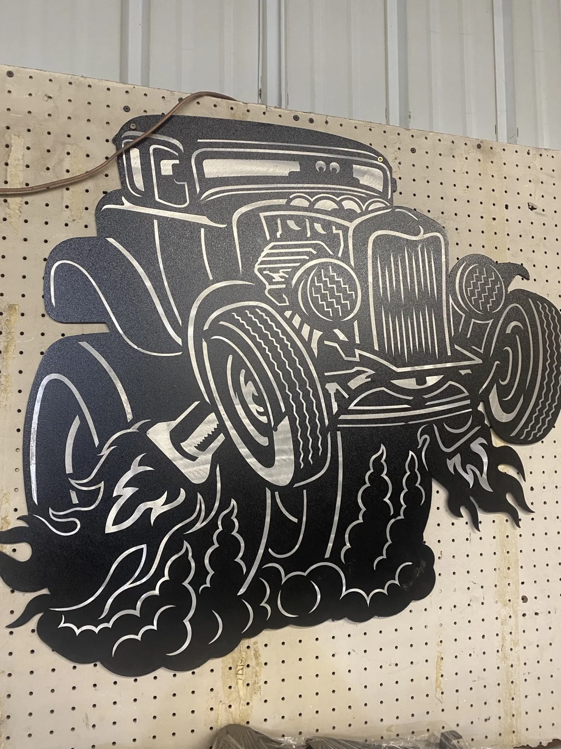 Hot-rod wall art made from one-eighth-inch brushed aluminum with Hammer Black powder coat