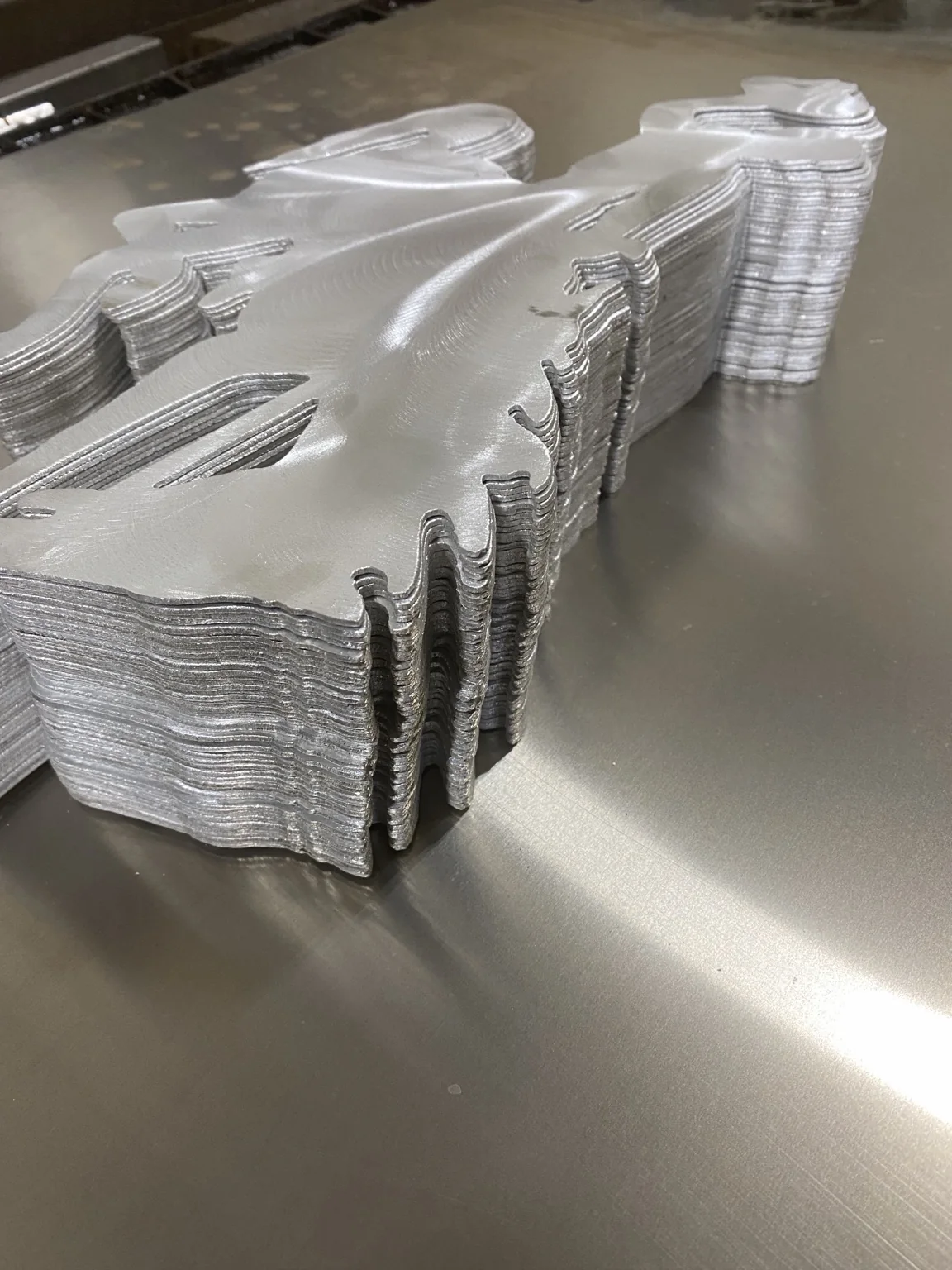 Stacked aluminum Steamboat recognition pieces with offsets, powder coat, and engraving